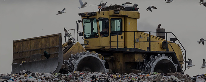 tracktor in a field of garbages